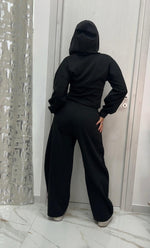 Tuta black con cappuccio