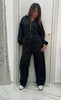 Tuta black con cappuccio
